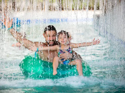 Father and daughter in the lazy river Centara Mirage Beach Resort Dubai