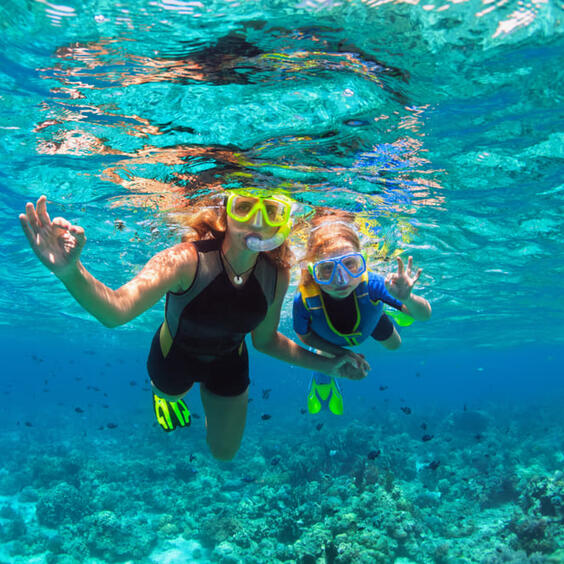 A mother and daughter snorkelling