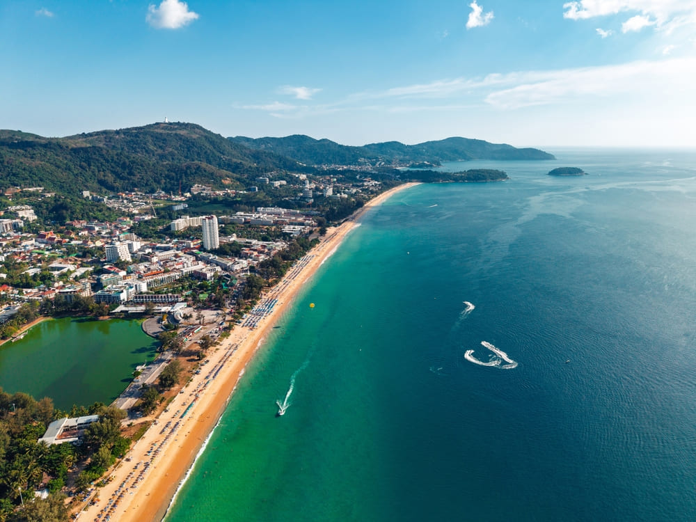 A scenic aerial view of Karon Beach in Phuket - for the best group stay Phuket near beach
